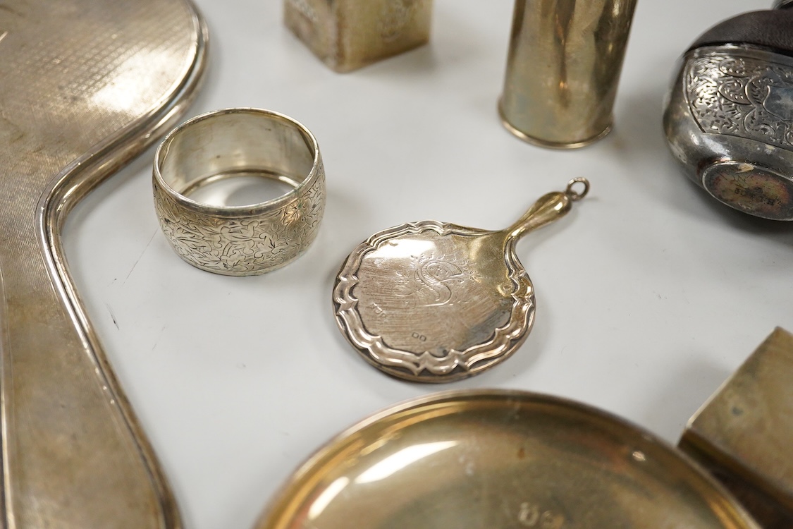 Sundry small silver, including two cigarette cases, a match sleeve holder, three napkin rings, two condiments, matchbox sleeve, shaving brush canister, commemorative small dish, a mounted hand mirror and mounted handbag